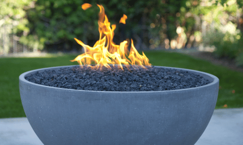 close up of a built in firepit using fuel instead of wood