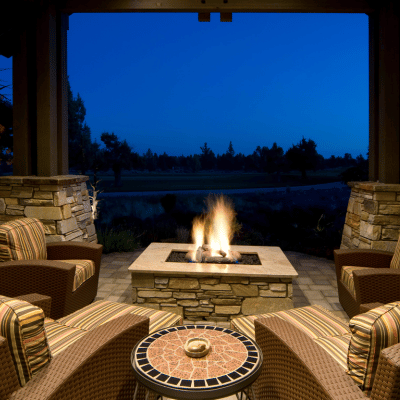 outdoor side table placed by the fire pit for functionality and convenience