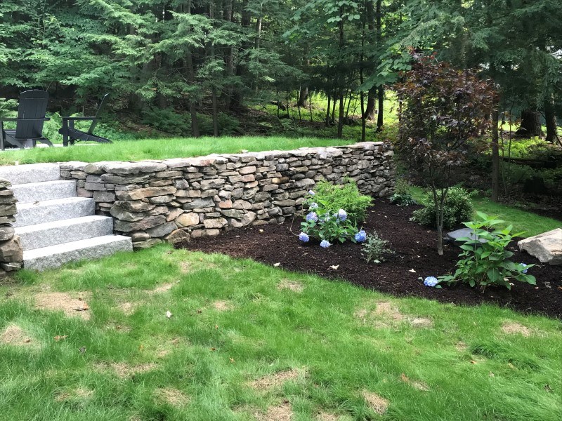 Retaining wall in grass yard